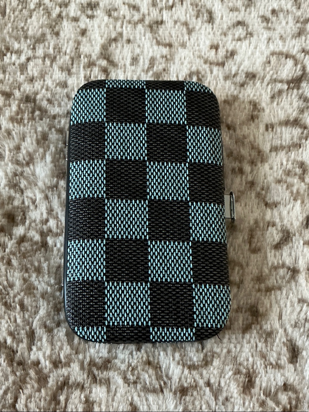 Checker Pattern Case with 8-piece manicure and pedicure grooming kit set.